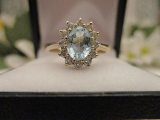 A Blue Topaz and Diamond Ring.