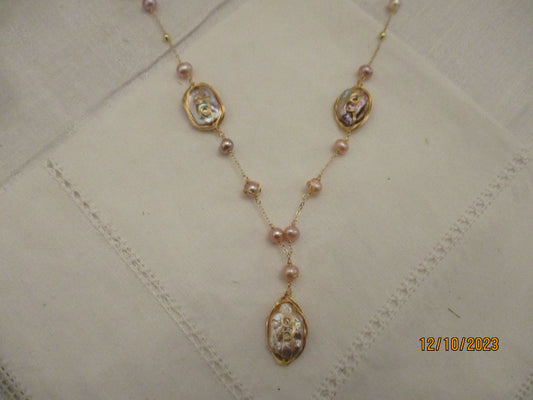 A Long Pearl and Mother of Pearl Necklace.